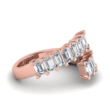 Emerald cut lab grown diamond open cuff bypass ring with prong setting in rose gold tone.