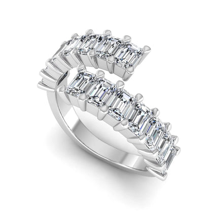 Emerald cut lab grown diamond open cuff bypass ring with prong setting in white gold tone.