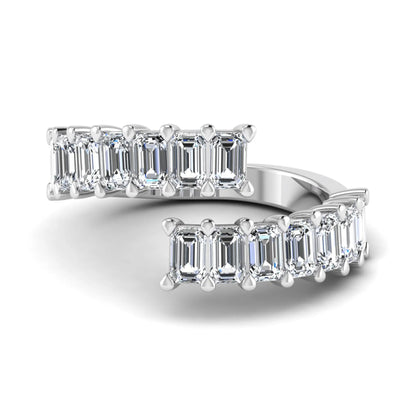 Emerald cut lab grown diamond open cuff bypass ring with prong setting in white gold tone.