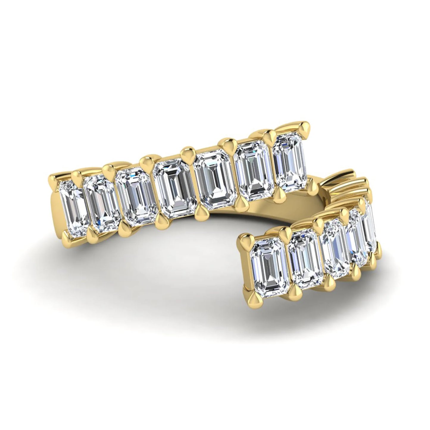 Emerald cut lab grown diamond open cuff bypass ring with prong setting in yellow gold tone.