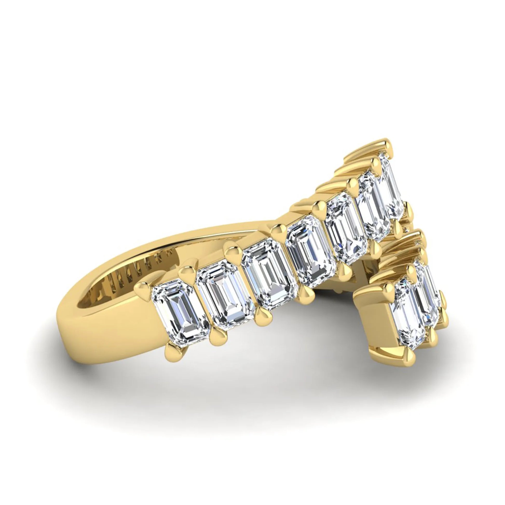 Emerald cut lab grown diamond open cuff bypass ring with prong setting in yellow gold tone.