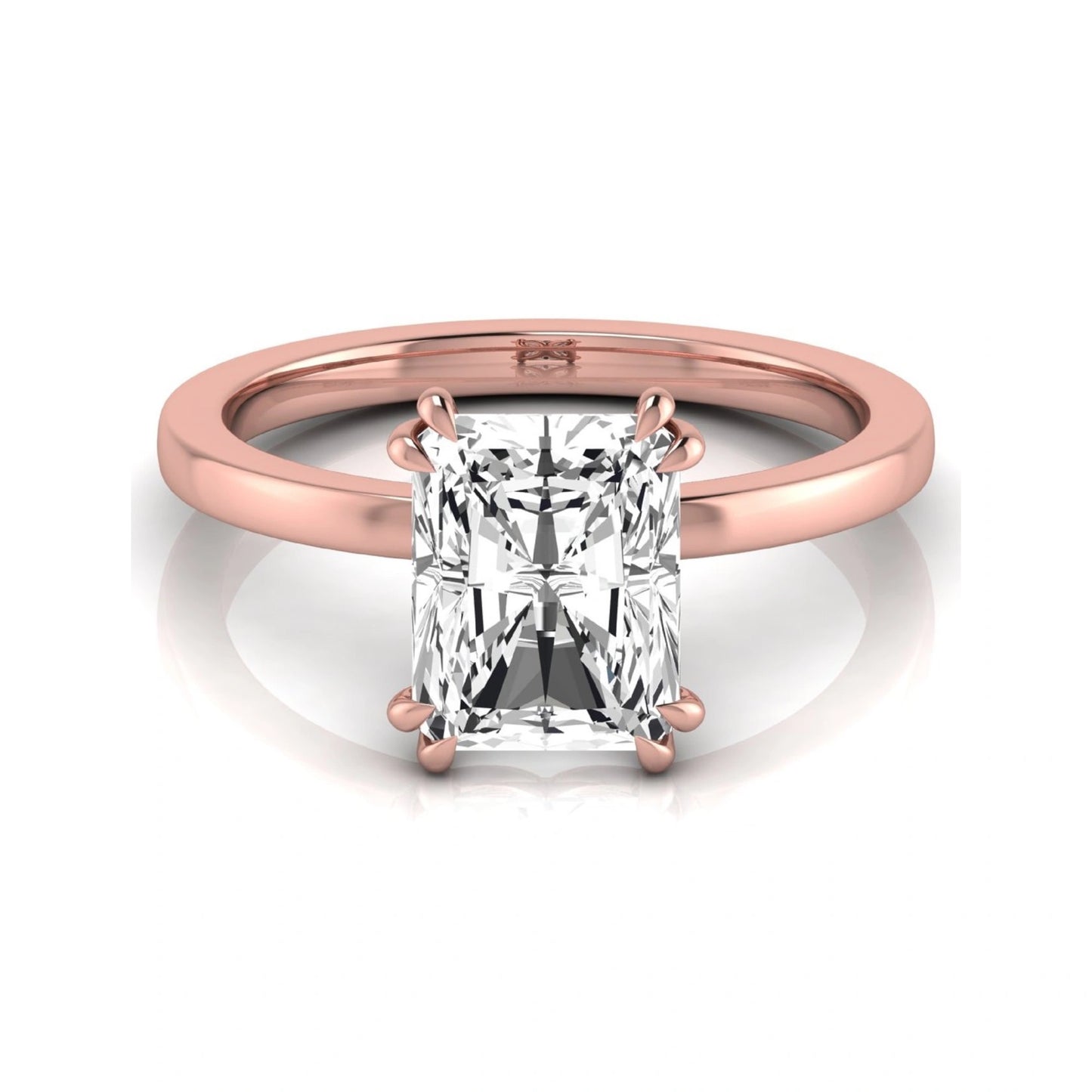Emerald cut lab grown diamond solitaire engagement ring featuring an approximately 2.62 carat IGI certified emerald cut diamond in a classic four-prong rose gold setting.