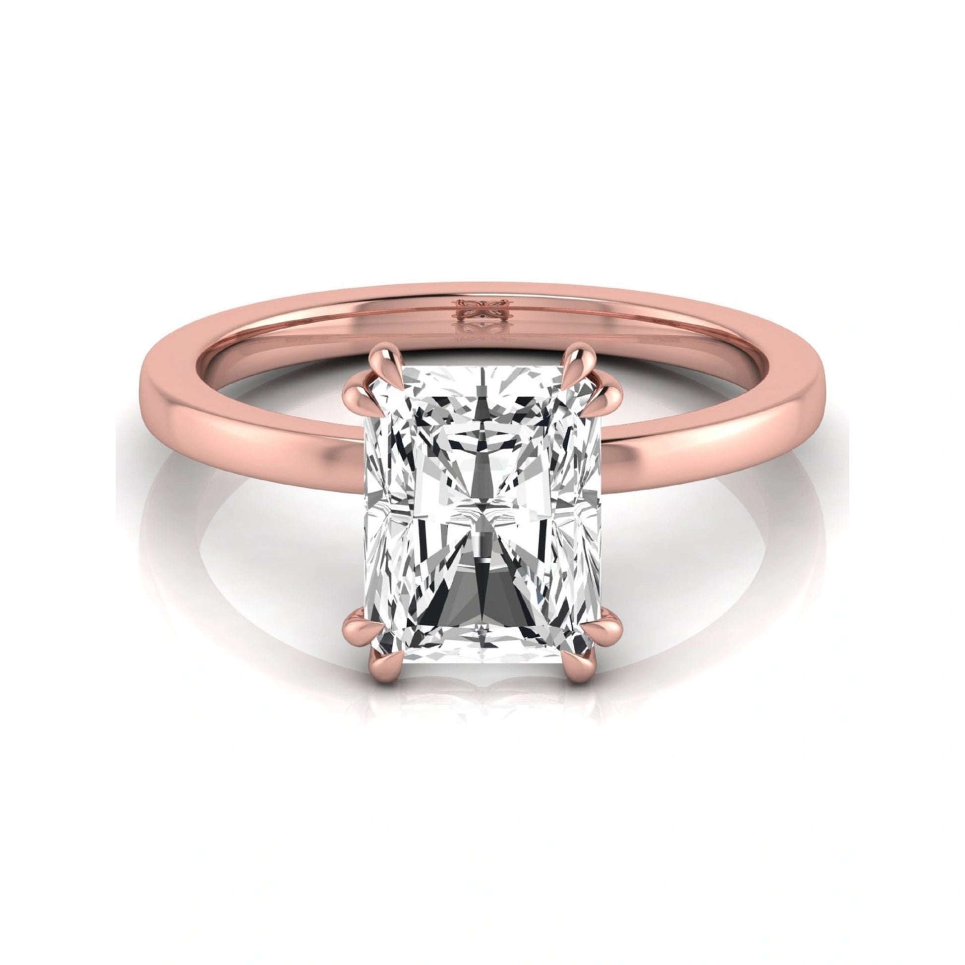 Emerald cut lab grown diamond solitaire engagement ring featuring an approximately 2.62 carat IGI certified emerald cut diamond in a classic four-prong rose gold setting.