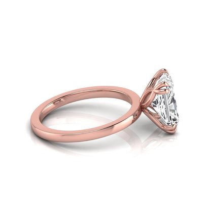 Emerald cut lab grown diamond solitaire engagement ring featuring an approximately 2.62 carat IGI certified emerald cut diamond in a classic four-prong rose gold setting.