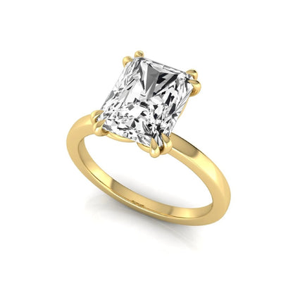 Emerald cut lab grown diamond solitaire engagement ring featuring an approximately 2.62 carat IGI certified emerald cut diamond in a classic four-prong yellow gold setting.