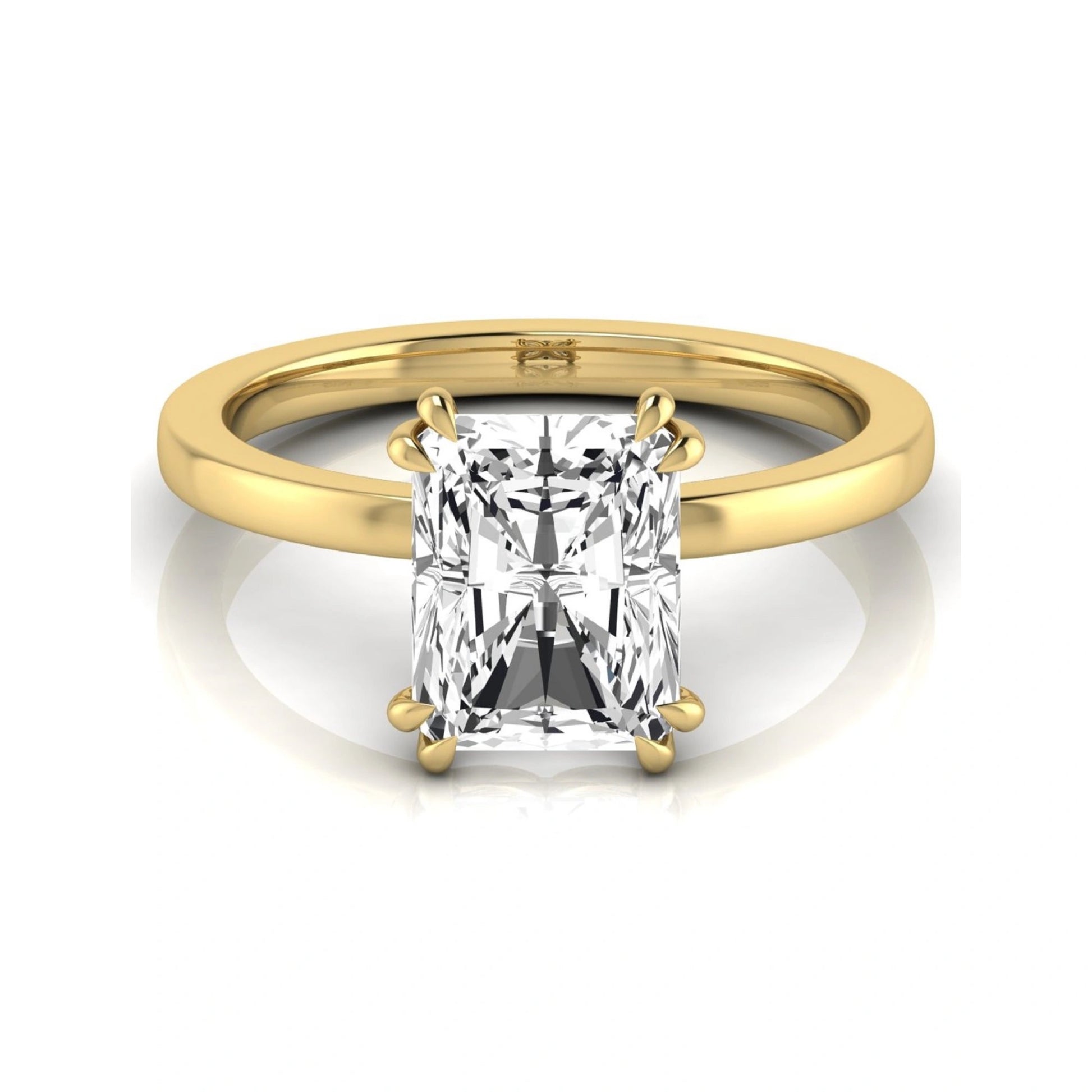 Emerald cut lab grown diamond solitaire engagement ring featuring an approximately 2.62 carat IGI certified emerald cut diamond in a classic four-prong yellow gold setting.