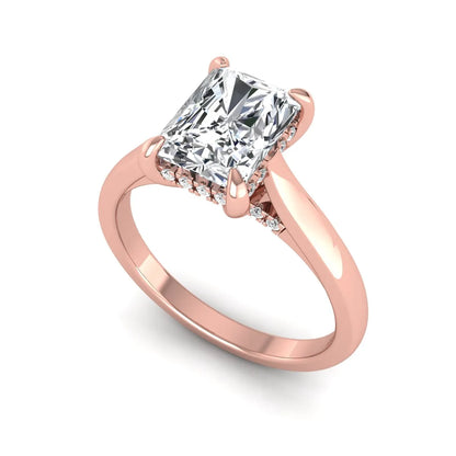 Emerald cut lab grown diamond solitaire engagement ring featuring a 1.74 carat IGI certified center diamond with hidden pavé accents in rose gold.