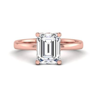 Emerald cut lab grown diamond solitaire engagement ring featuring a 2.62 carat IGI certified center diamond in rose gold.