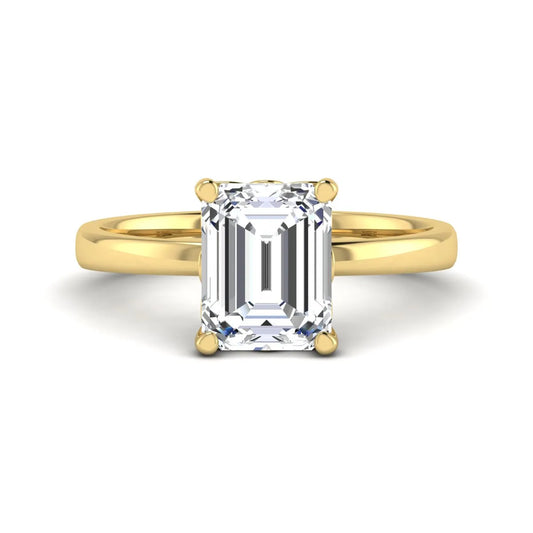 Emerald cut lab grown diamond solitaire engagement ring featuring a 2.62 carat IGI certified center diamond in yellow gold.