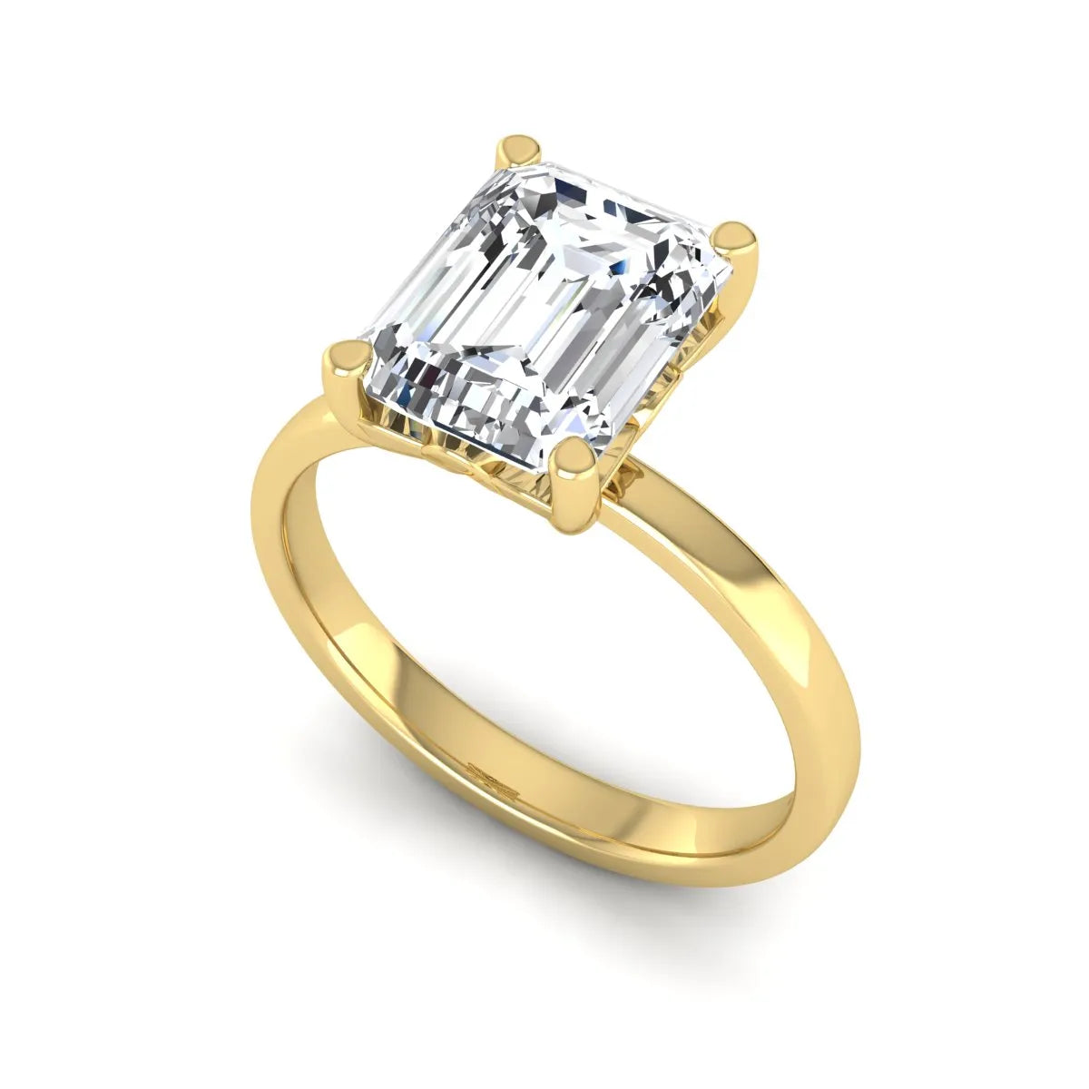 Emerald cut lab grown diamond solitaire engagement ring featuring a 2.62 carat IGI certified center diamond in yellow gold.