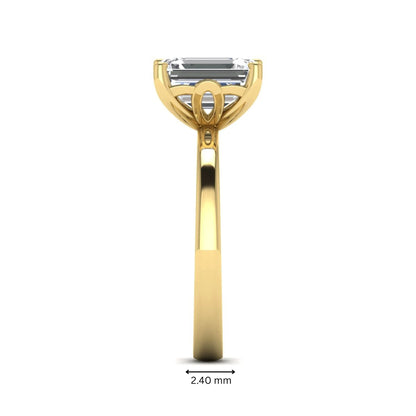 Emerald cut lab grown diamond solitaire engagement ring featuring a 2.62 carat IGI certified center diamond in yellow gold.