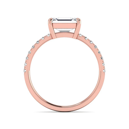 Emerald cut lab grown diamond solitaire pavé engagement ring with four-prong setting and rose gold tone band.