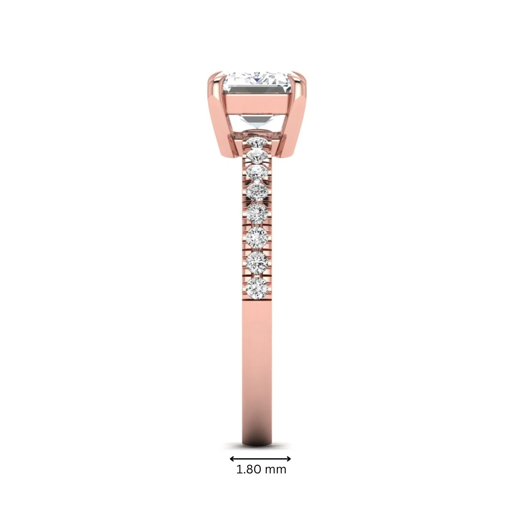 Emerald cut lab grown diamond solitaire pavé engagement ring with four-prong setting and rose gold tone band.