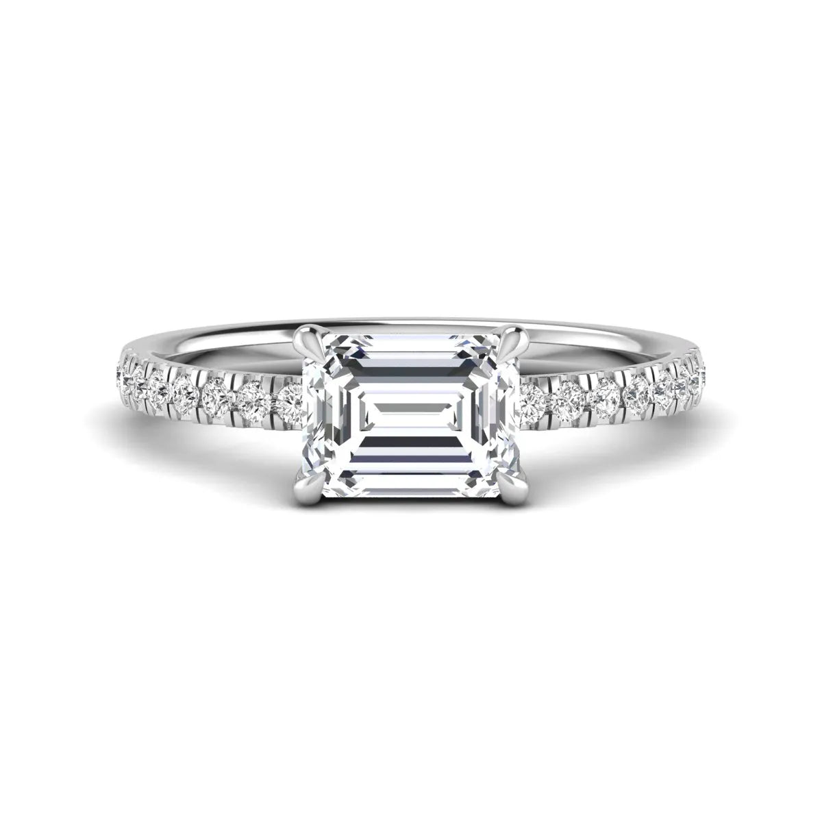 Emerald cut lab grown diamond solitaire pavé engagement ring with four-prong setting and white gold tone band.