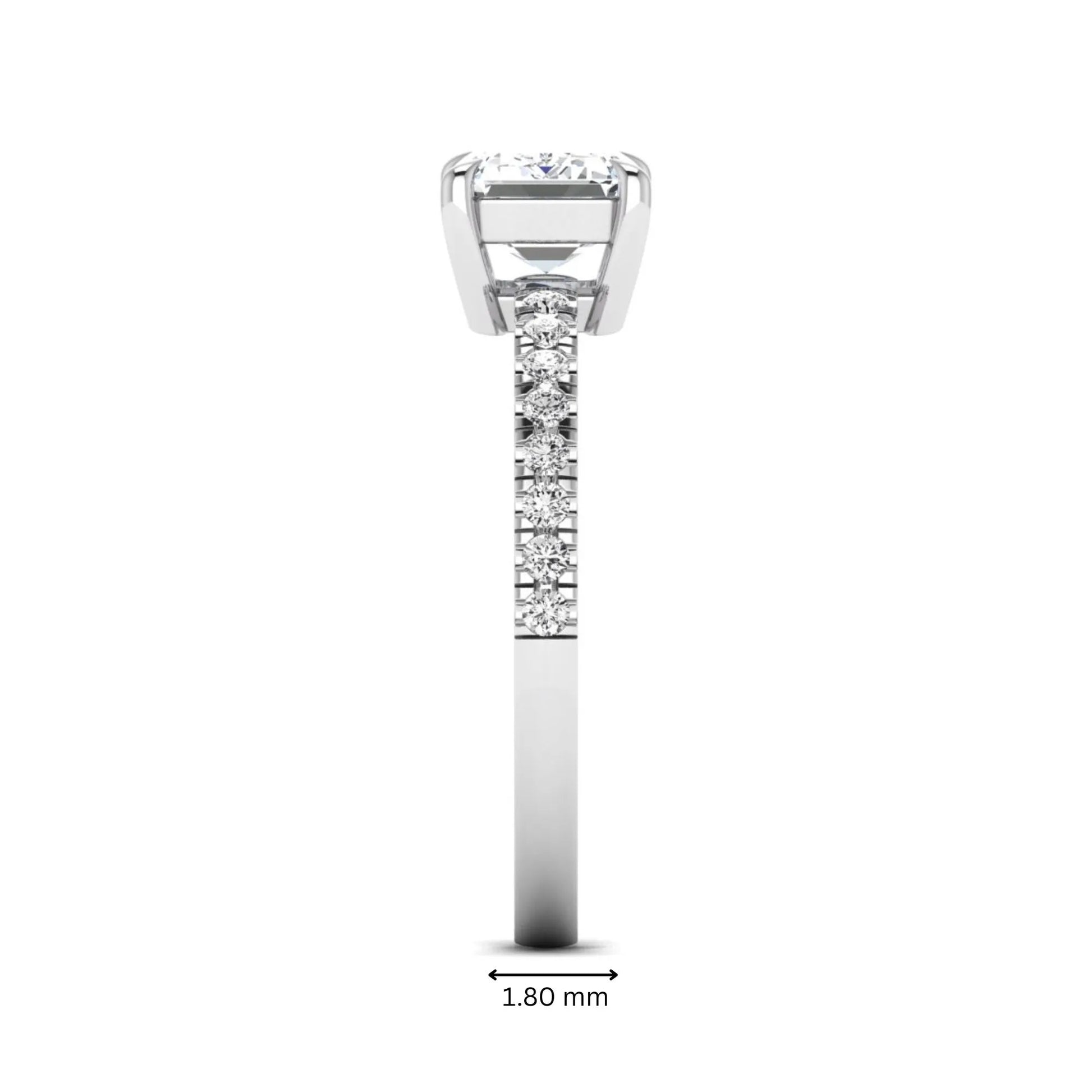 Emerald cut lab grown diamond solitaire pavé engagement ring with four-prong setting and white gold tone band.