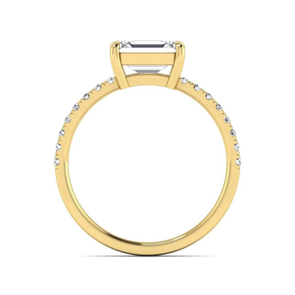 Emerald cut lab grown diamond solitaire pavé engagement ring with four-prong setting and yellow gold tone band.