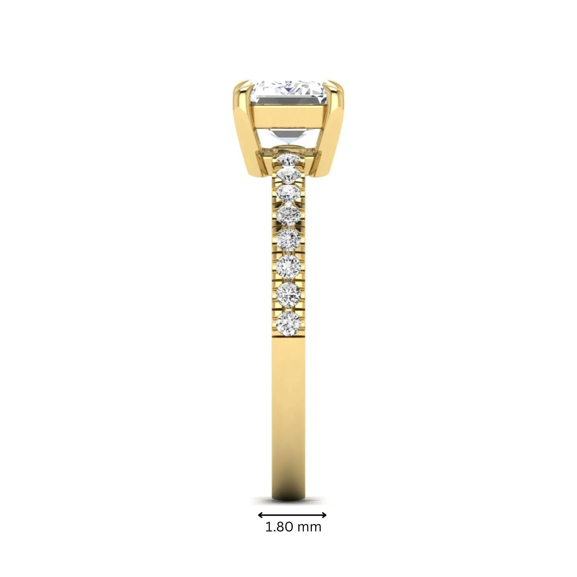 Emerald cut lab grown diamond solitaire pavé engagement ring with four-prong setting and yellow gold tone band.