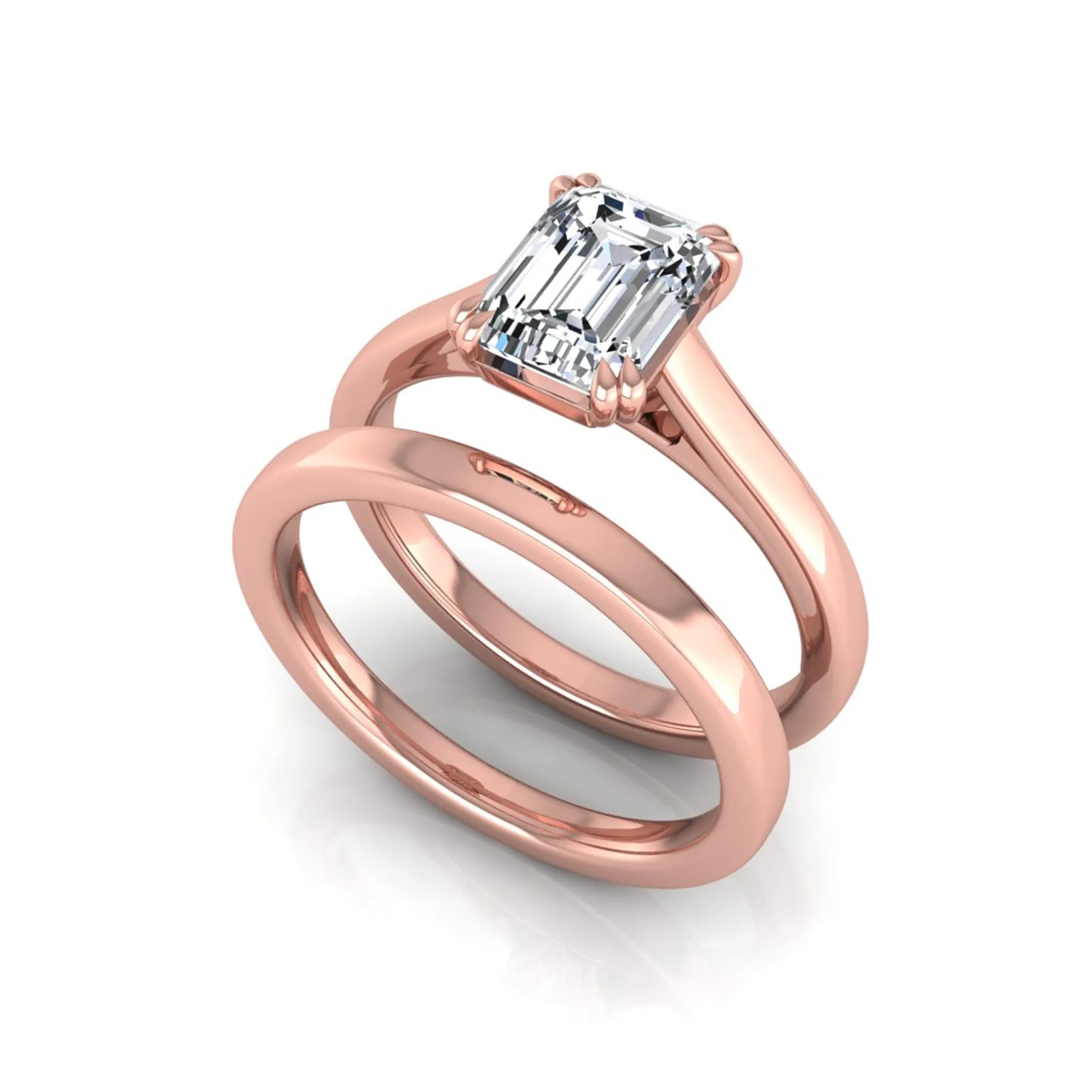 Emerald cut lab grown diamond solitaire ring set featuring a 1.74 carat IGI certified center diamond in a four-prong setting with a matching plain wedding band in a rose gold design.