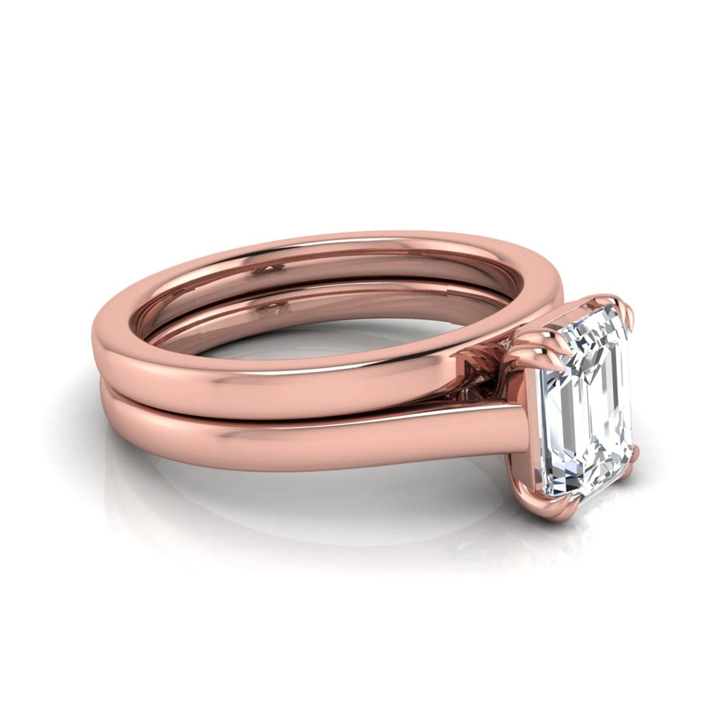 Emerald cut lab grown diamond solitaire ring set featuring a 1.74 carat IGI certified center diamond in a four-prong setting with a matching plain wedding band in a rose gold design.