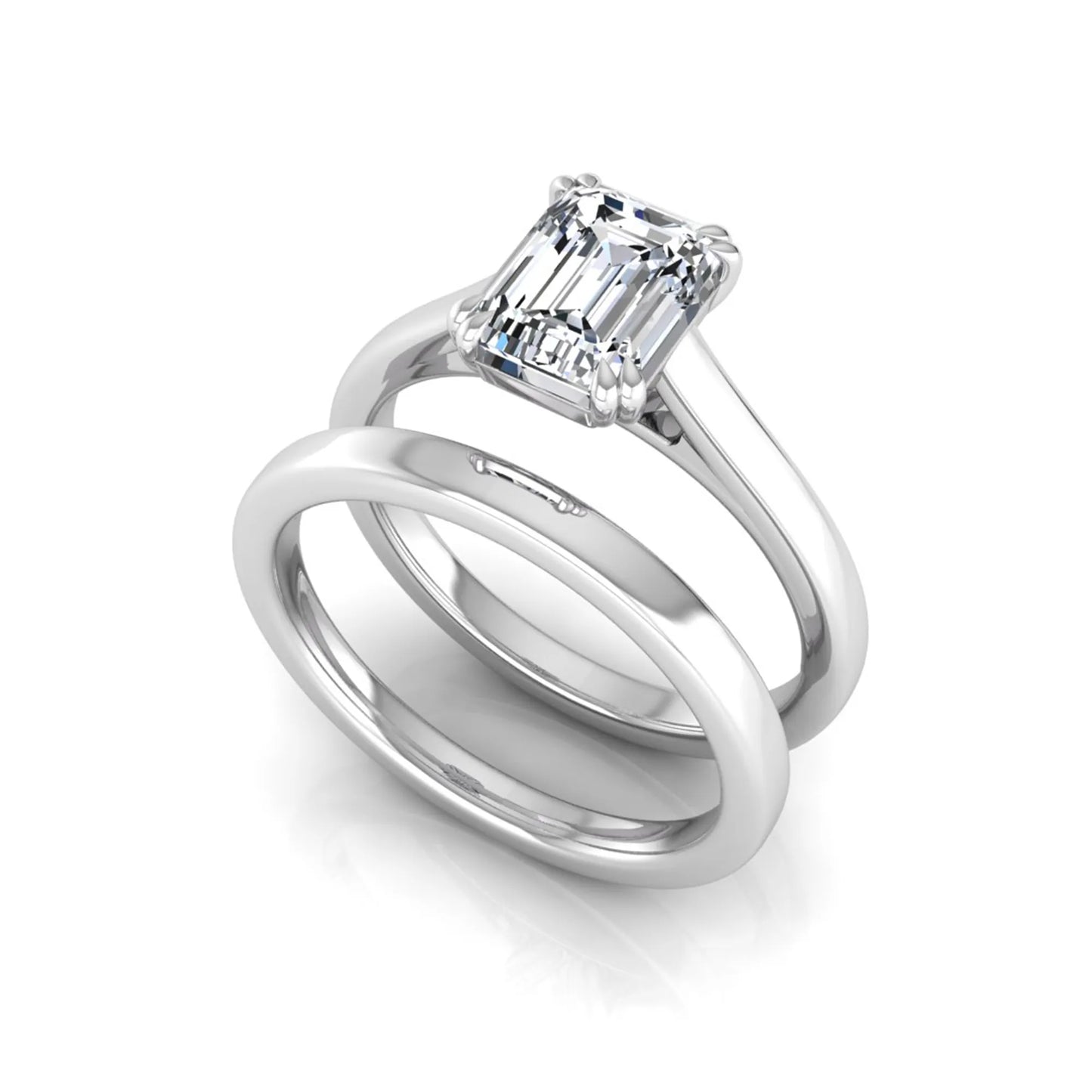 Emerald cut lab grown diamond solitaire ring set featuring a 1.74 carat IGI certified center diamond in a four-prong setting with a matching plain wedding band in a white gold design.