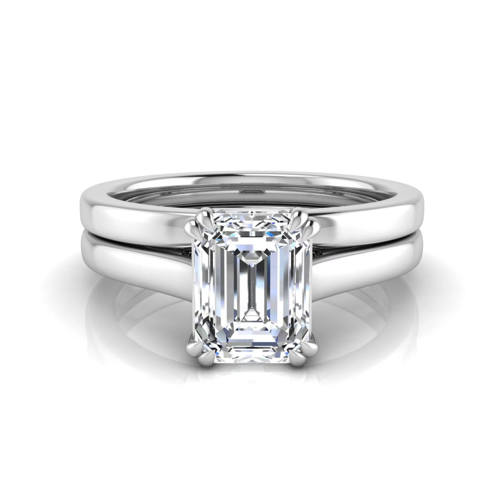 Emerald cut lab grown diamond solitaire ring set featuring a 1.74 carat IGI certified center diamond in a four-prong setting with a matching plain wedding band in a white gold design.