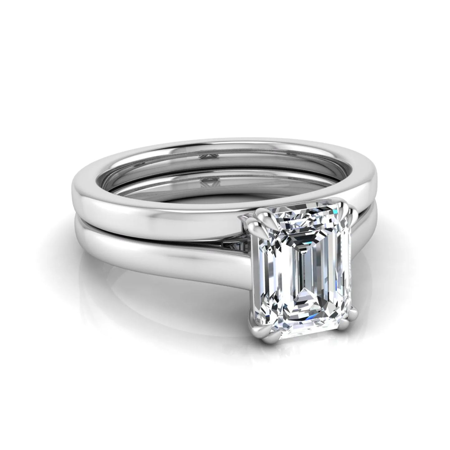 Emerald cut lab grown diamond solitaire ring set featuring a 1.74 carat IGI certified center diamond in a four-prong setting with a matching plain wedding band in a white gold design.