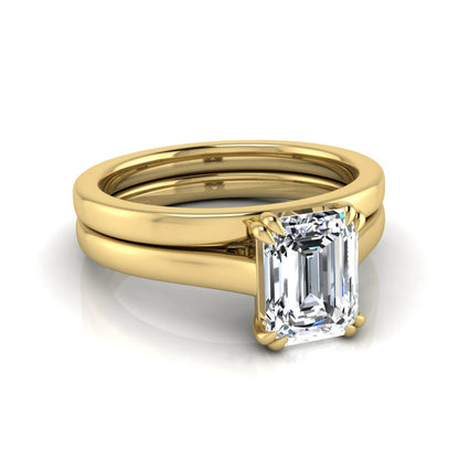 Emerald cut lab grown diamond solitaire ring set featuring a 1.74 carat IGI certified center diamond in a four-prong setting with a matching plain wedding band in a yellow gold design.