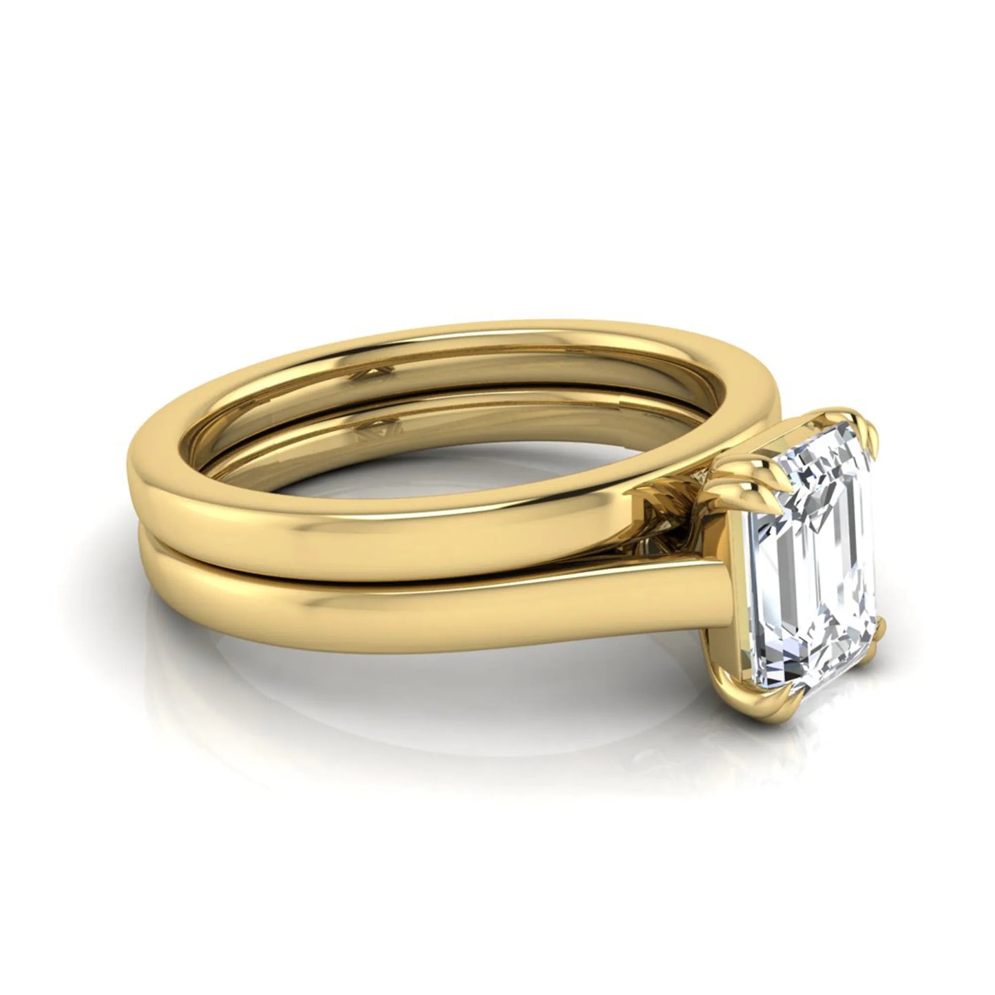 Emerald cut lab grown diamond solitaire ring set featuring a 1.74 carat IGI certified center diamond in a four-prong setting with a matching plain wedding band in a yellow gold design.