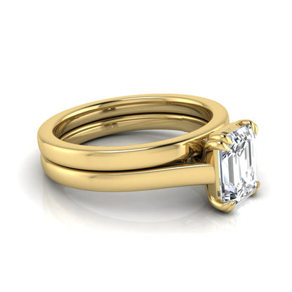 Emerald cut lab grown diamond solitaire ring set featuring a 1.74 carat IGI certified center diamond in a four-prong setting with a matching plain wedding band in a yellow gold design.