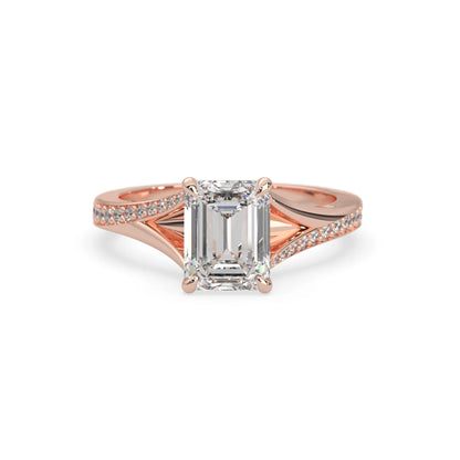 Rose gold ring with a diamond on a white background