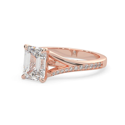 Rose gold ring with a large diamond and smaller diamonds on the band against a white background