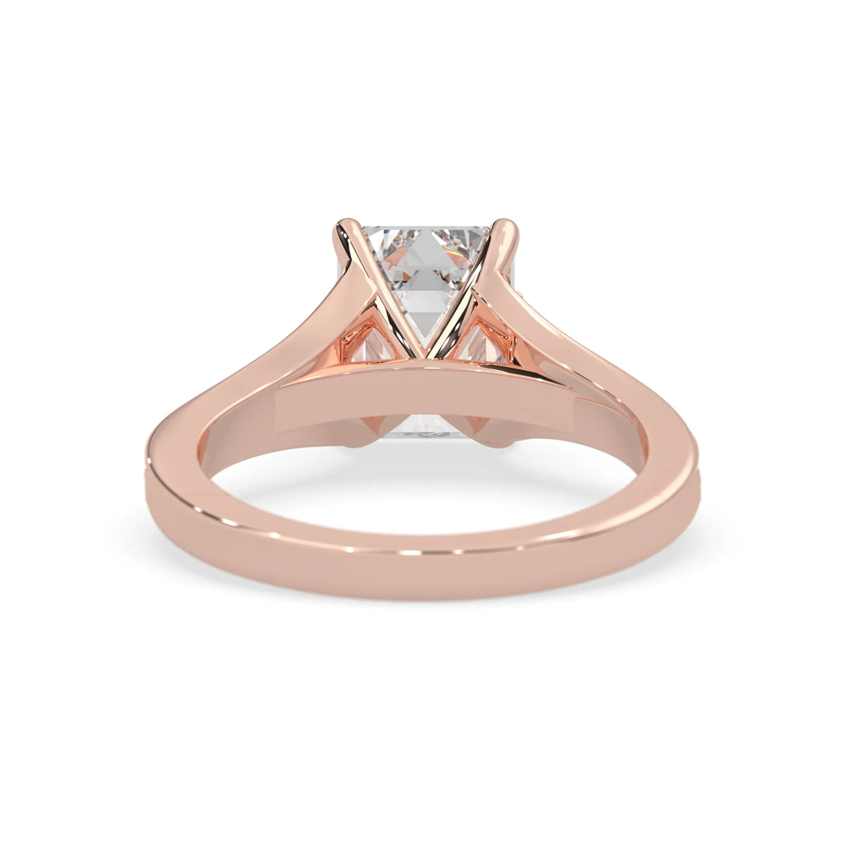 Rose gold ring with a diamond on a white background