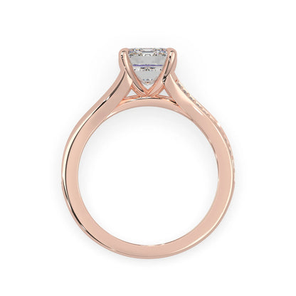 Rose gold ring with a diamond on a white background