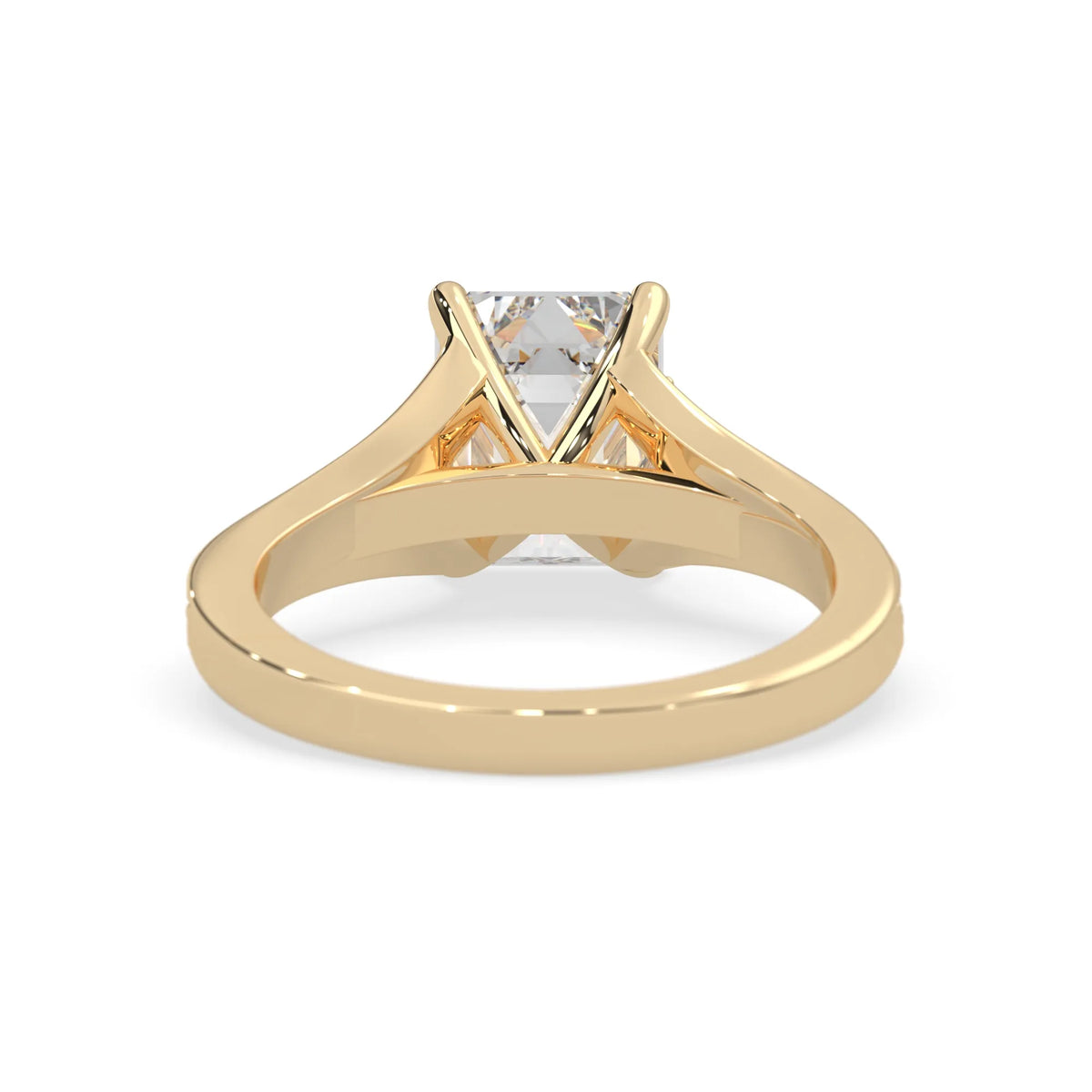 yellow Gold ring with a diamond on a white background