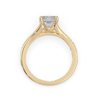 yellow Gold ring with a diamond on a white background