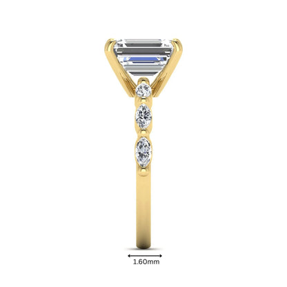 IGI Certified 2.62 carat Emerald cut lab grown diamond engagement ring with marquise cut side diamonds in yellow gold.