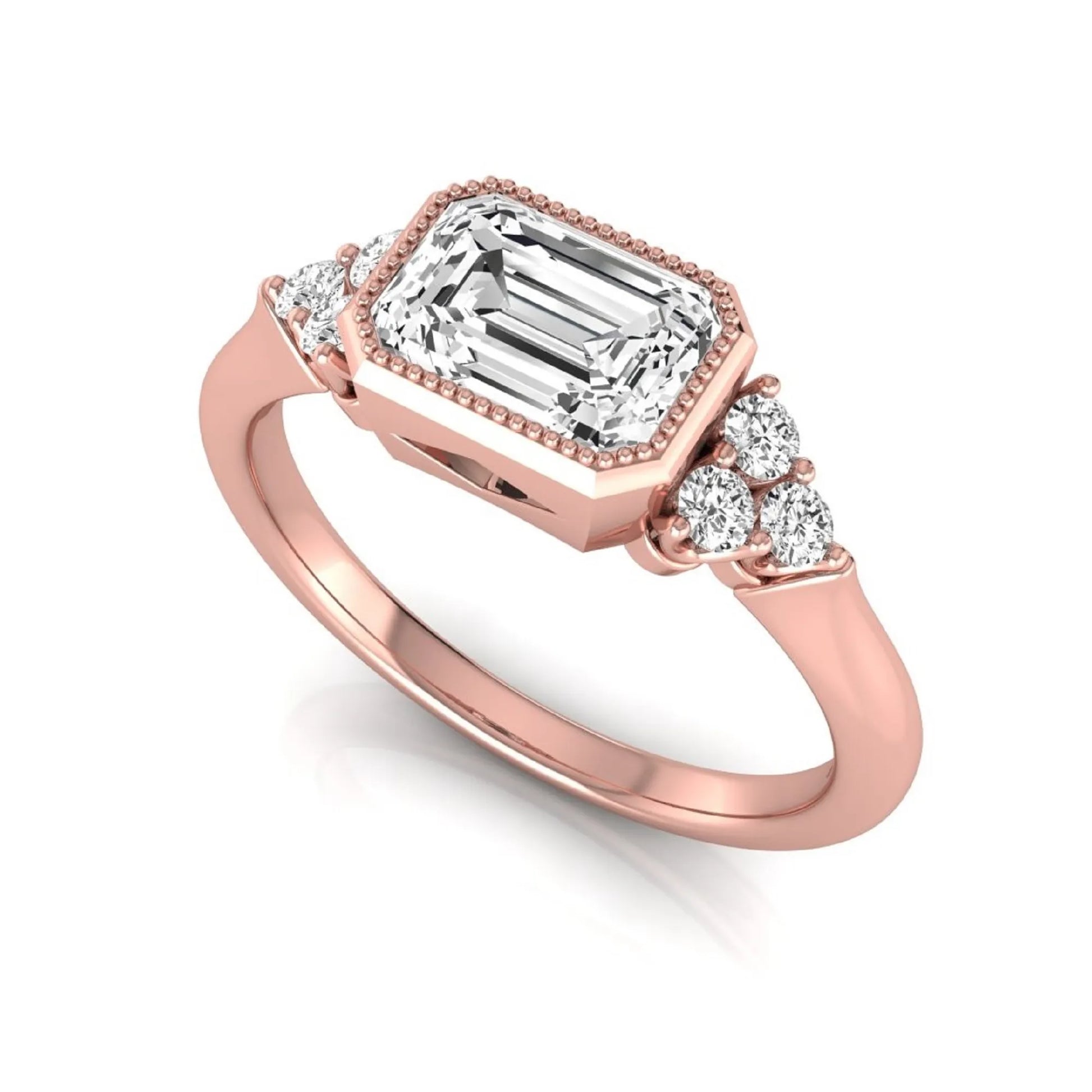 Emerald cut lab grown diamond engagement ring featuring a milgrain bezel setting with round side stone clusters in rose gold.