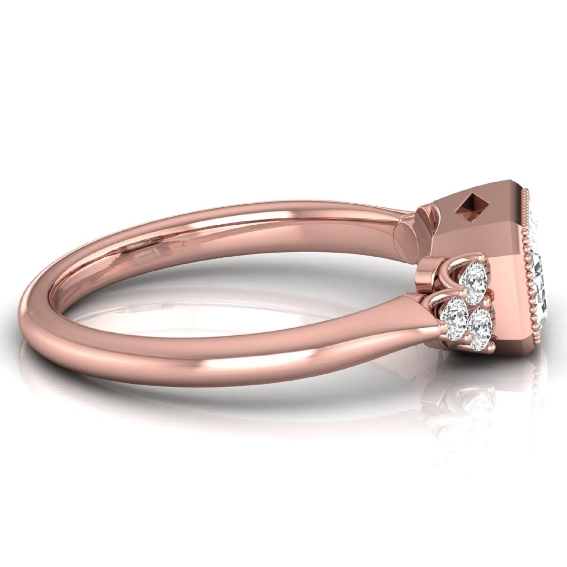 Emerald cut lab grown diamond engagement ring featuring a milgrain bezel setting with round side stone clusters in rose gold.