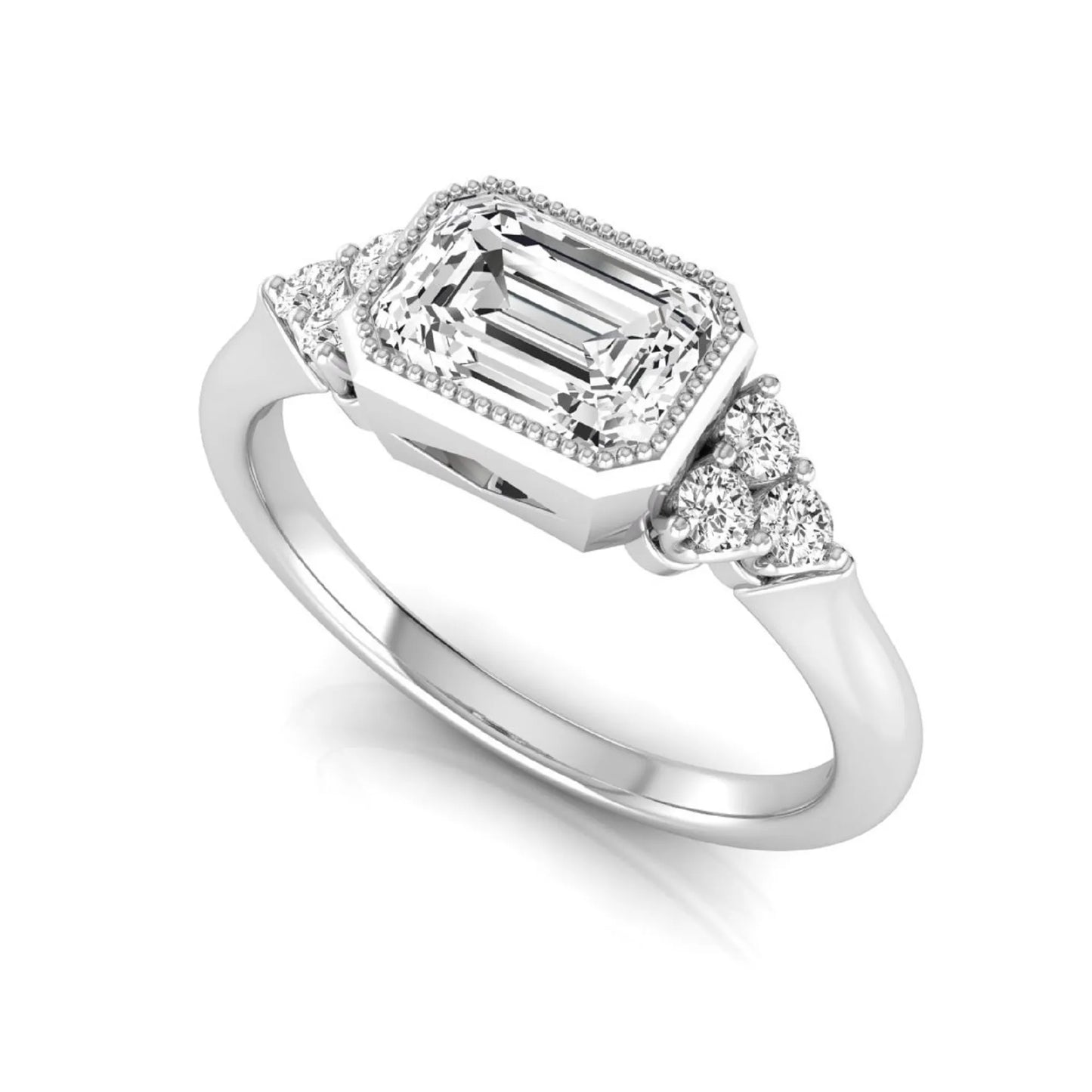 Emerald cut lab grown diamond engagement ring featuring a milgrain bezel setting with round side stone clusters in white gold.