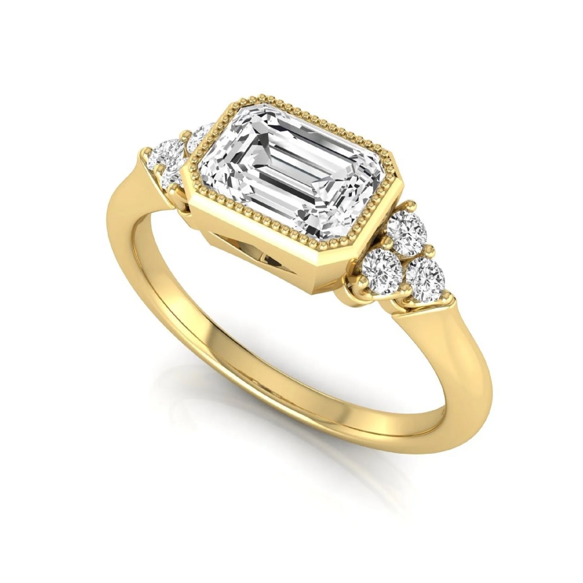 Emerald cut lab grown diamond engagement ring featuring a milgrain bezel setting with round side stone clusters in yellow gold.