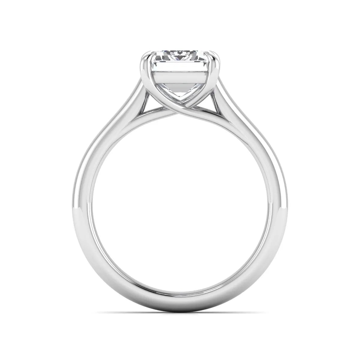 Emerald cut lab grown diamond solitaire engagement ring with a four-prong setting and polished tapered white gold band.