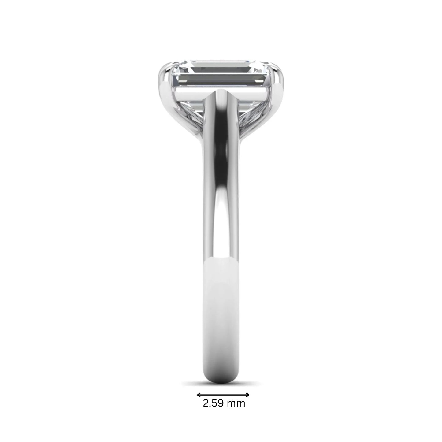 Emerald cut lab grown diamond solitaire engagement ring with a four-prong setting and polished tapered white gold band.