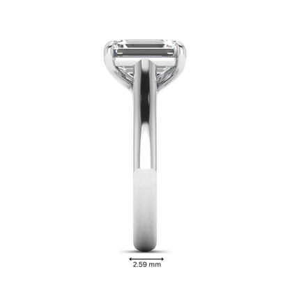 Emerald cut lab grown diamond solitaire engagement ring with a four-prong setting and polished tapered white gold band.