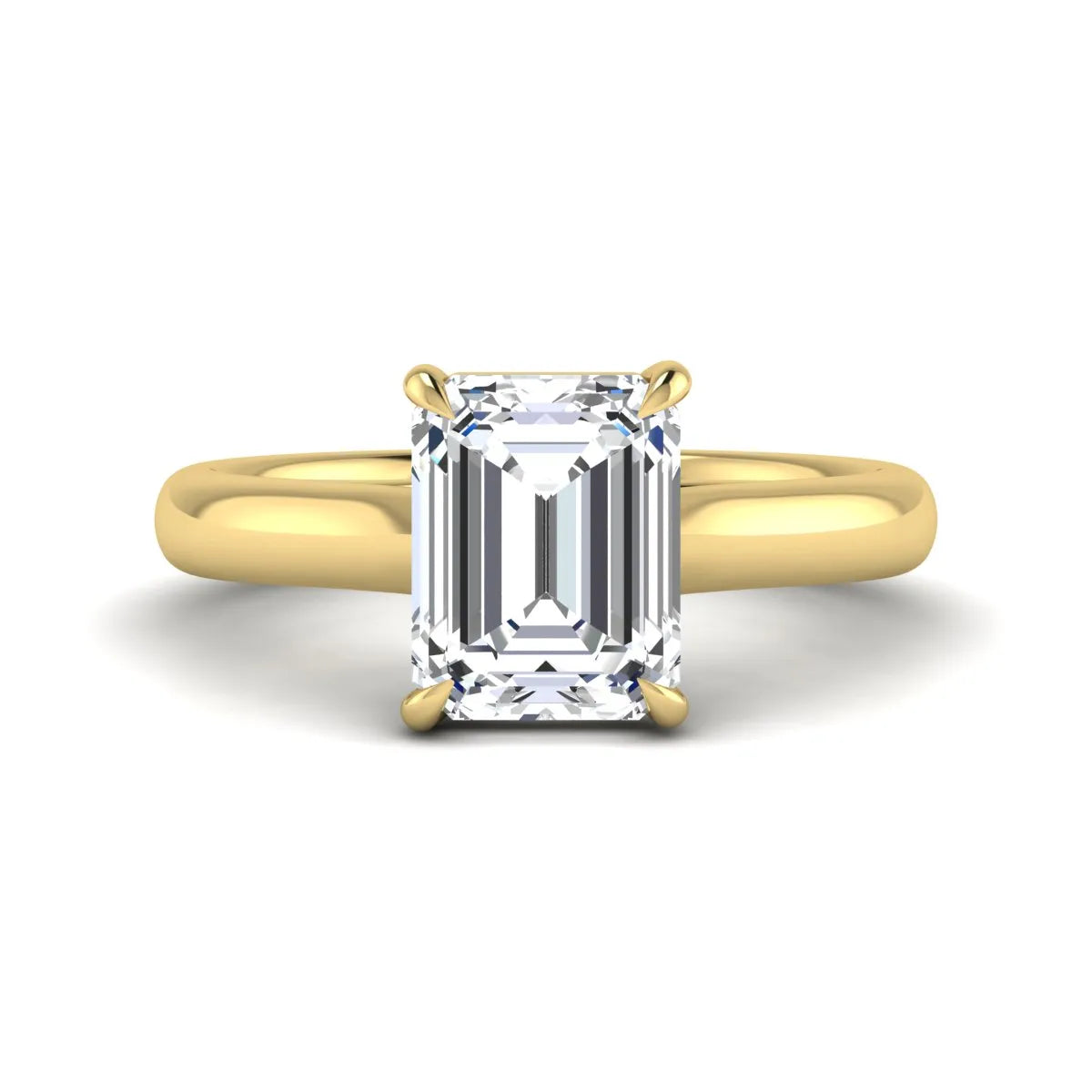 Emerald cut lab grown diamond solitaire engagement ring with a four-prong setting and polished tapered yellow gold band.