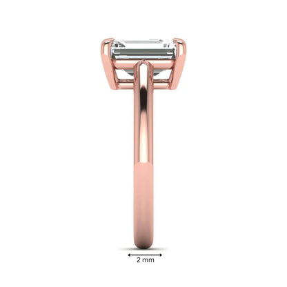 Emerald Cut Solitaire Lab Grown Diamond Engagement Ring featuring a 9.05 × 6.62 mm IGI Certified emerald-cut diamond in a four-prong cathedral setting with a polished rose gold band.