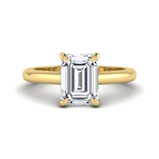 Emerald Cut Solitaire Lab Grown Diamond Engagement Ring featuring a 9.05 × 6.62 mm IGI Certified emerald-cut diamond in a four-prong cathedral setting with a polished yellow gold band.
