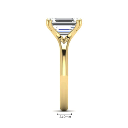 Emerald Cut Lab Grown Diamond Solitaire Engagement Ring featuring an IGI certified emerald cut center diamond in a four-prong setting with a yellow gold tone band.