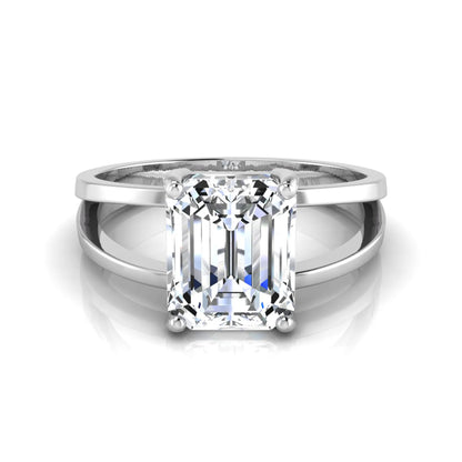 Emerald cut lab grown diamond split shank engagement ring featuring a classic four-prong setting and polished white gold style band.