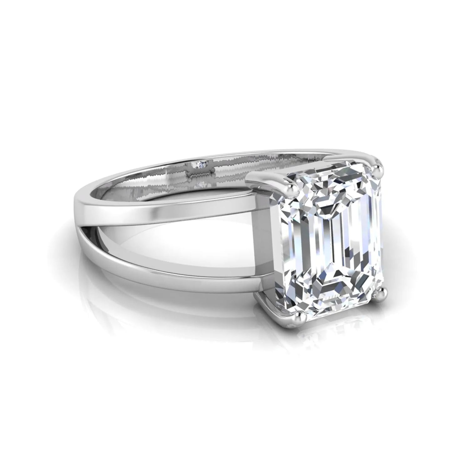 Emerald cut lab grown diamond split shank engagement ring featuring a classic four-prong setting and polished white gold style band.