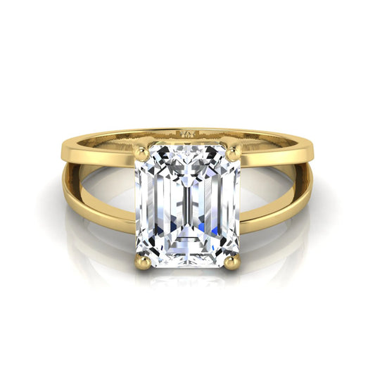 Emerald cut lab grown diamond split shank engagement ring featuring a classic four-prong setting and polished yellow gold style band.